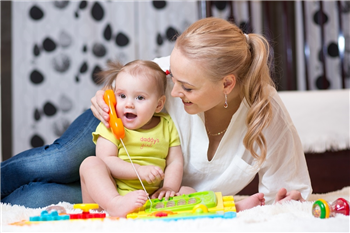 baby small talk a mum playing with the baby